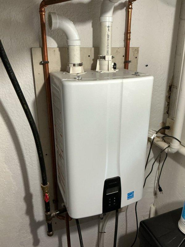 Performed complete flush and fill service on two Navien tankless water heaters to remove mineral buildup and maintain optimal performance. Accessed internal components, circulated descaling solution through heat exchangers, and refilled systems according to manufacturer specifications. Additionally replaced water filter cartridge in customer's existing filtration system per request.