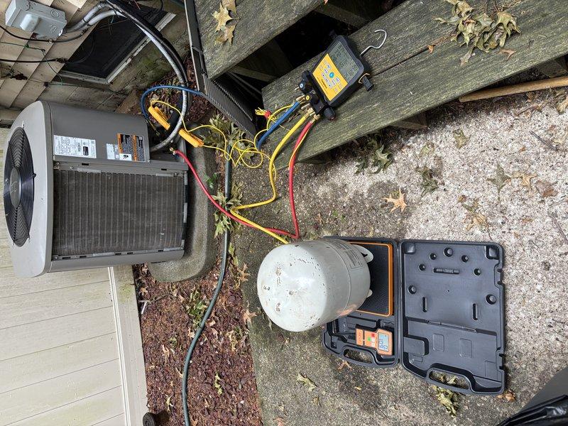 Completed MVP cooling maintenance visit on 8-year-old system. Performed comprehensive diagnostic evaluation using digital manifold gauges and refrigerant testing equipment. Inspected outdoor condenser unit, which showed significant accumulation of dirt and debris on internal filter/coil requiring attention. Connected test hoses and monitoring equipment to assess system pressures and refrigerant levels. Addressed maintenance needs to ensure optimal cooling performance for the upcoming season.