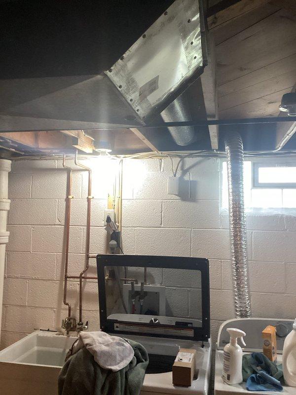Responded to service call for installation of two exterior electrical outlets. Assessed exterior wall location and interior basement access point near utility sink area. Ran new electrical wiring through basement ceiling joists and exterior wall penetration. Installed weatherproof outlet boxes on building exterior with appropriate GFCI protection for outdoor use. Verified proper grounding, tested circuits for functionality, and sealed all exterior penetrations to prevent moisture intrusion.