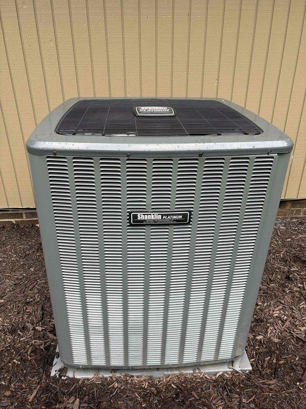 Completed routine maintenance and inspection on Shanklin Platinum outdoor condensing unit. Accessed electrical compartment and verified proper operation of capacitor, contactors, and control board; all wiring connections secure with no signs of overheating or damage. Unit operating within normal parameters with adequate airflow through condenser coils.