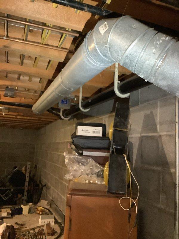 Conducted free estimate for tankless water heater replacement due to loss of hot water supply to upper level fixtures while lower level maintained functionality. Inspected existing Bosch tankless unit mounted on basement wall with copper supply lines, shut-off valves, and PVC venting system. Documented current installation configuration including plumbing connections, gas lines, and electrical supply for replacement planning and customer proposal.