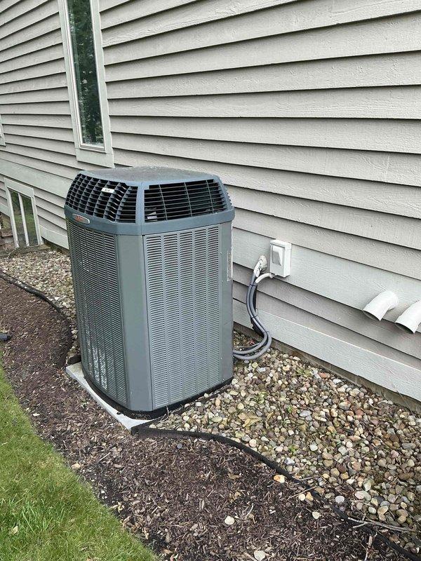 Conducted on-site evaluation for furnace replacement estimate at residential property. Assessed existing Trane furnace installation in basement mechanical room and exterior AC condenser unit. Documented current HVAC system configuration including venting, ductwork, electrical connections, and equipment placement to provide comprehensive replacement options.