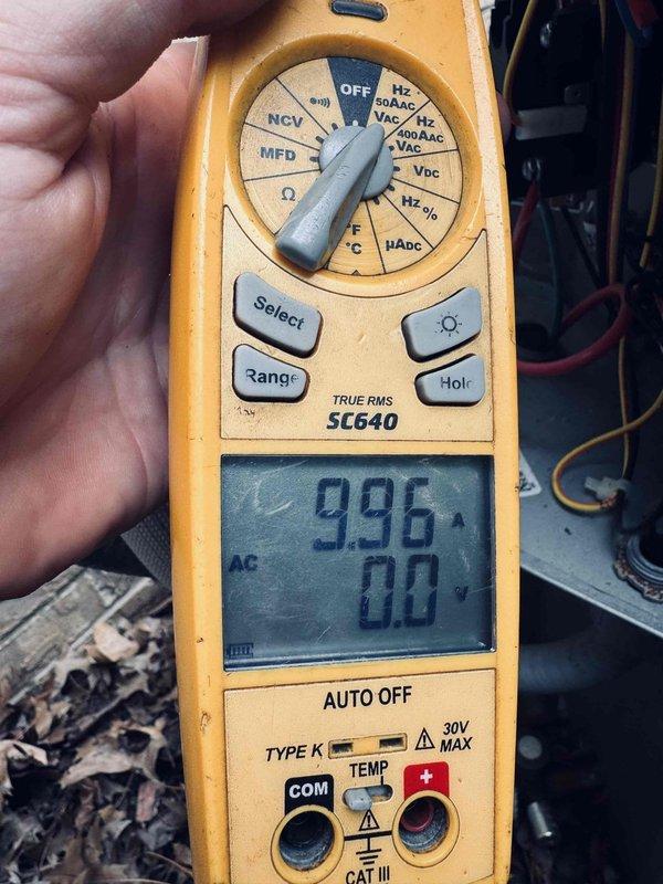 Completed MVP cooling maintenance visit on HVAC system. Performed electrical diagnostics using digital multimeter, recording capacitance reading of 996 MFD to verify compressor and fan motor capacitor operation within specifications. Inspected blower assembly and squirrel cage fan wheel, confirming clean condition of blades with no debris accumulation or mechanical wear. All components operating properly with no service issues identified.