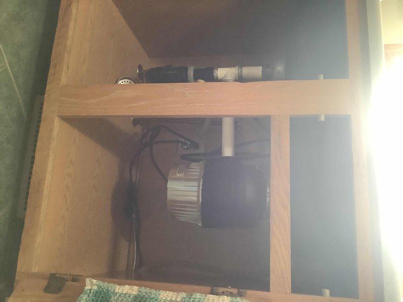 Installed InSinkErator garbage disposal unit under kitchen sink using customer-provided components. Connected disposal flange to sink drain opening, secured mounting assembly, and completed all electrical connections to ensure proper operation. Verified disposal functionality and confirmed no leaks at drain connections.