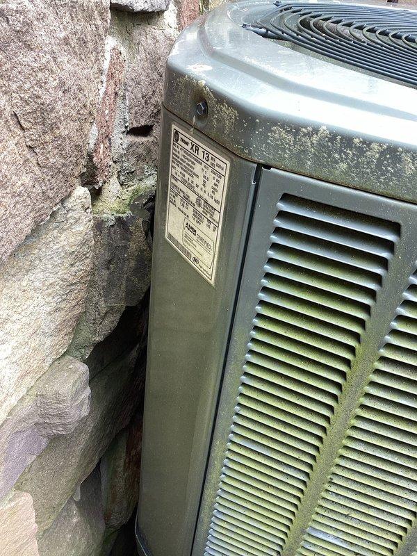 Performed preventative maintenance tune-up on two residential air conditioning systems. Inspected outdoor condenser units, both showing significant age with weathered casings and biological growth on exterior surfaces. Verified proper operation of compressor, condenser fan motor, and electrical components on both units. Checked refrigerant levels and pressures within manufacturer specifications. Cleaned condenser coils to remove accumulated debris and organic matter. Inspected electrical connections and tightened terminals as needed. Evaluated airflow through ventilation louvers and confirmed adequate clearance around units for proper operation. Both systems operating within normal parameters upon completion of tune-up service.