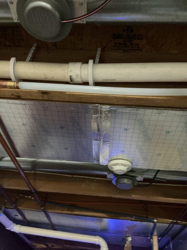 Replaced existing 2015 Bradford White conventional water heater with new Navien NPE-240A2 tankless water heater system. Mounted unit on panel board affixed to wall behind furnace to optimize space utilization and ensure proper clearances. Connected condensate drain line routing to existing floor drain for proper discharge. Integrated new unit exhaust into existing water heater vent pipe system. Coordinated electrical installation of dedicated outlet to provide required power supply for tankless unit operation. All parts and materials, including Navien installation kit, were pre-staged prior to installation. Completed all plumbing connections, verified proper water flow, tested gas connections for leaks, and confirmed unit operational functionality upon startup.