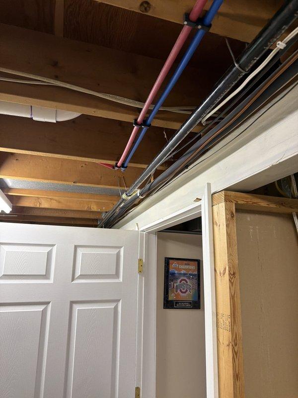 Replaced and rerouted the main gas line in the basement area, tying back into existing lines serving the appliances. New gas piping was properly secured to ceiling joists with appropriate mounting brackets and integrated with the existing gas distribution system. All connections were completed to code specifications and the system was tested for proper operation and safety.