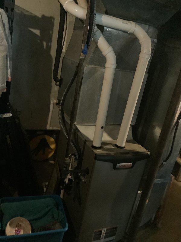 Conducted comprehensive on-site evaluation for complete HVAC system replacement. Assessed existing outdoor condensing unit with protective cage enclosure and indoor furnace installation with associated PVC venting and condensate drainage systems. Documented current equipment conditions and spatial configurations to develop accurate replacement proposal specifications.