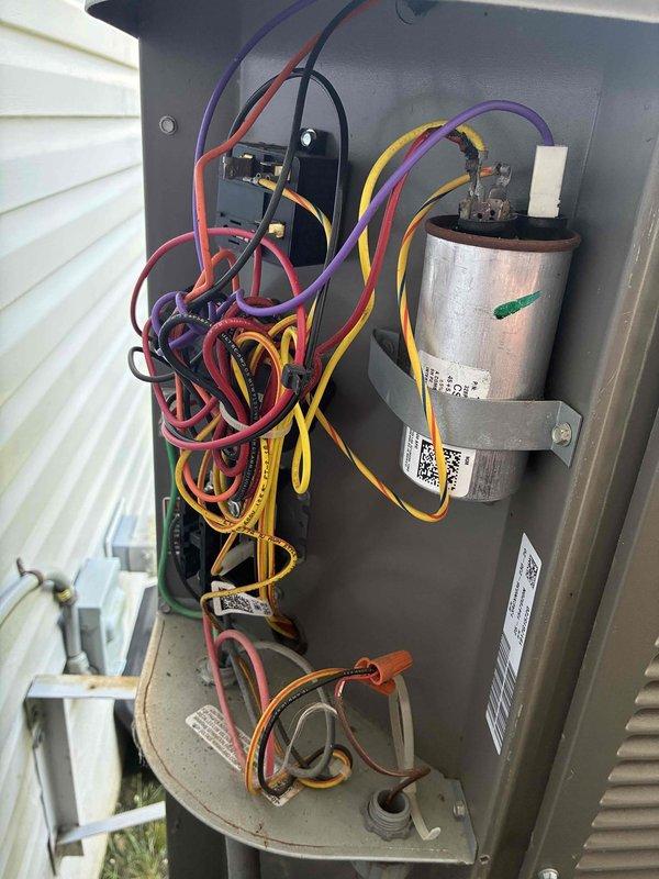 Completed routine air conditioning maintenance visit on an 8-year-old system. Performed system inspection with access panel removed, verified electrical connections including capacitor and contactor operation, and documented supply air temperature reading of 57°F at ductwork, confirming proper cooling performance.