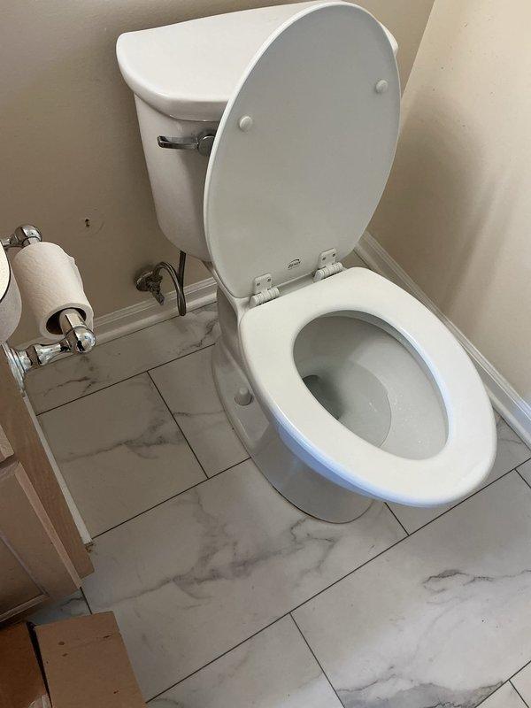 Responded to service call for toilet leaking around base, which had been previously installed. Upon inspection, found evidence of water staining on tile flooring and grout lines surrounding toilet base, indicating ongoing leak. Removed toilet to access wax ring and flange connection. Discovered compromised wax ring seal causing water to escape during flushing. Cleaned flange area, scraped old wax residue, and inspected flange bolts and mounting hardware for proper condition. Installed new wax ring with polyethylene flange, ensuring proper compression and seal. Reset toilet, tightened closet bolts to manufacturer specifications, and reconnected water supply line. Tested flush mechanism multiple times to verify proper seal and confirm no leakage at base. Cleaned work area and advised homeowner to monitor for any further moisture issues.