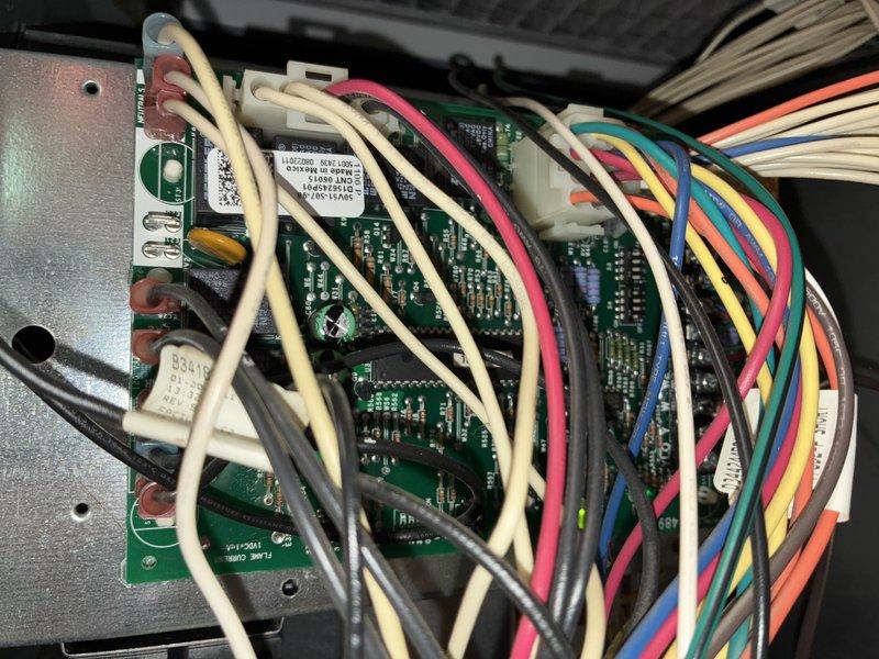 Completed scheduled air conditioning maintenance on 15-year-old system for MVP customer. Inspected and documented air filter condition showing moderate dust accumulation, and examined control board with all electrical connections and wiring harnesses intact and functioning properly. System operational and ready for cooling season.