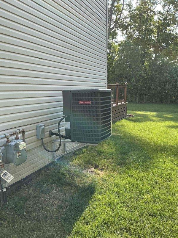 Conducted comprehensive HVAC system evaluation for potential replacement, documenting existing Goodman condensing unit and furnace installation. Customer requested leak search diagnostic despite identified cracked drain pan on current system, with photographic documentation completed of both indoor furnace/plenum assembly and outdoor condensing unit for estimate preparation.