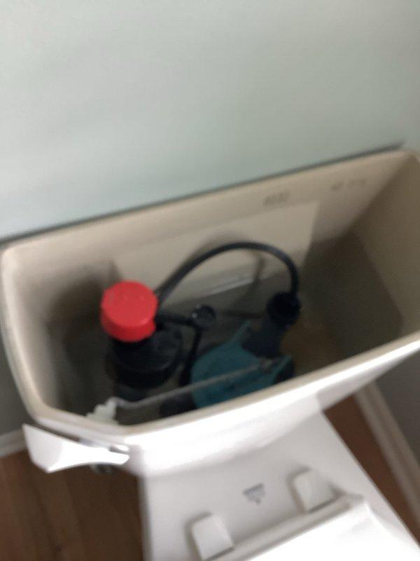 Responded to service call for water leak at first floor bathroom vanity trap following recent customer installation. Upon inspection, identified improper connection at P-trap assembly beneath newly installed vanity. Tightened slip joint connections on white PVC P-trap system and verified proper alignment of drain components. Tested system for leaks by running water through vanity drain and confirmed repair successful with no further water discharge at trap connections.