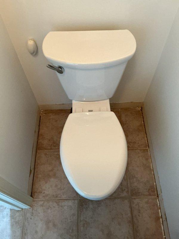 Installed new American Standard Cadet Pro comfort height toilet in master bathroom featuring 16.5" elongated bowl and slow-close seat with new supply line. Additionally replaced fill valve, flapper, and supply line on upstairs toilet as part of bundled service. Both installations completed to restore proper functionality and improve water efficiency.