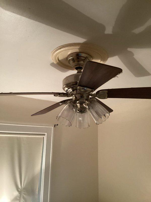 Responded to service call for non-functioning outlets and evaluated bedroom ceiling fan for potential replacement. Upon arrival, tested electrical outlets in the affected area and verified proper operation after inspection. Assessed existing ceiling fan with integrated light fixture, which featured wooden blades and glass globe shades. Determined fan and lighting assembly were functioning within normal parameters and did not require replacement at this time. Documented existing electrical configuration including outlet placement and ceiling fan installation for service records.