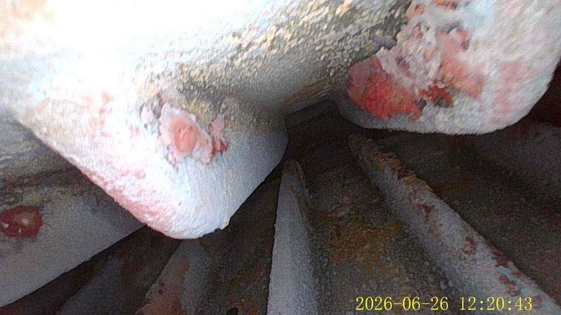 Responded to owner-occupied condo for boiler inspection on aging unit (20-30 years old). Upon arrival, discovered significant frost and ice accumulation on refrigerant lines and copper piping, indicating a refrigeration/HVAC system issue rather than standard boiler operation. The heavy crystalline frost buildup on both bare and insulated pipes suggests potential low refrigerant charge, restricted airflow, or metering device malfunction causing subnormal evaporator temperatures. Documented conditions with photos showing extensive ice formation on multiple pipe sections and foam insulation, with visible corrosion on underlying copper where frost was thinner. System requires further diagnostic evaluation to determine root cause of freezing condition and restore proper operation.