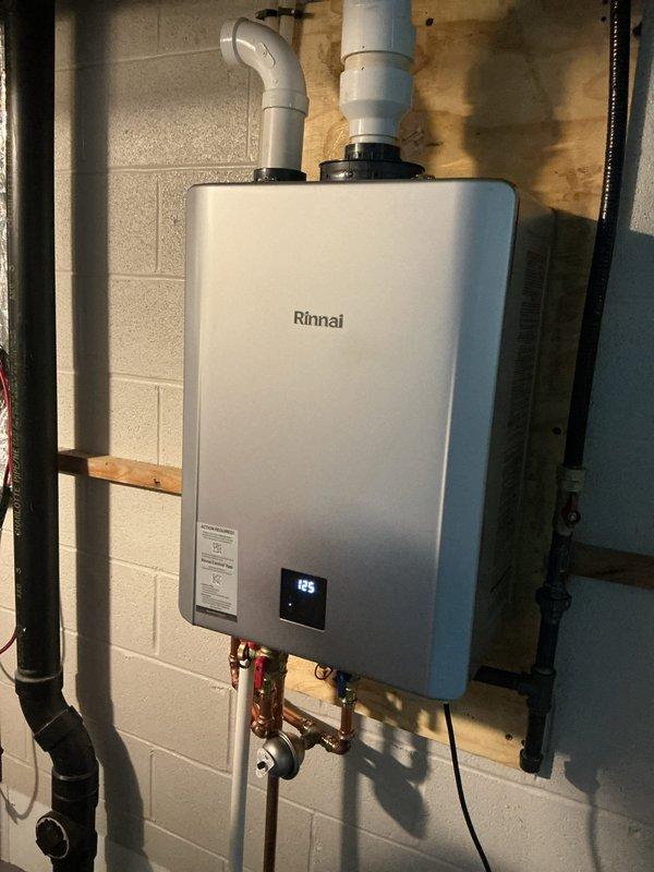 Completed tankless water heater flush and descaling service on Rinnai unit to maintain optimal performance and efficiency. Repaired defective hot water shut-off valve under kitchen sink, restoring proper water control functionality to the fixture.