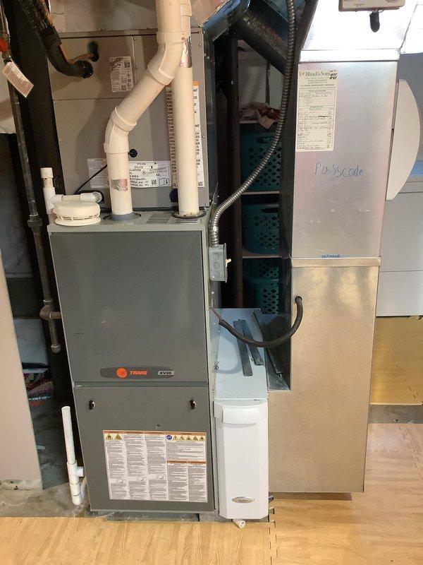Completed MVP Cooling Visit for residential HVAC system. Performed comprehensive inspection of Trane furnace unit in basement and outdoor condenser unit, verifying proper operation of all components. Documented system conditions through photographic records showing indoor air handler with connected PVC drainage lines, flexible conduit, and filter cabinet, as well as exterior condenser unit positioned on concrete pad with proper clearances and landscaping. All equipment found operating within normal parameters with no immediate service needs identified during this recurring maintenance visit.