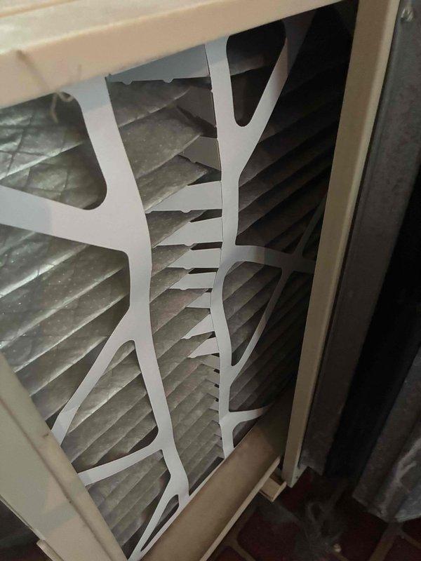 Completed annual MVP cooling maintenance visit on one-year-old HVAC system. Inspected evaporator coil and found moderate dust and debris accumulation on fins; documented condition with photos. Examined air filters showing significant dust buildup and discoloration, indicating normal usage over service interval. All system components inspected and operational.