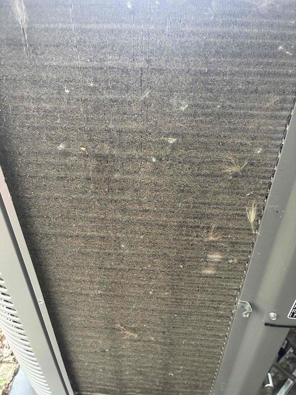 Completed annual MVP cooling maintenance visit on one-year-old HVAC system. Inspected evaporator coil and found moderate dust and debris accumulation on fins; documented condition with photos. Examined air filters showing significant dust buildup and discoloration, indicating normal usage over service interval. All system components inspected and operational.