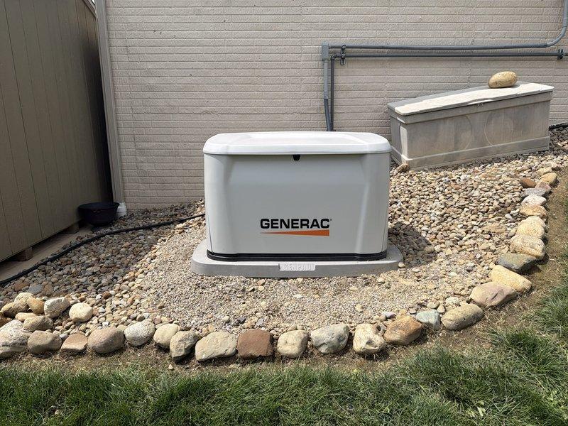 Responded to service call for recently installed Generac standby generator experiencing settlement issues. Upon arrival, confirmed unit was sinking into ground and no longer level on concrete pad. Assessed foundation and determined pad had settled unevenly, causing generator to tilt. Leveled generator unit by adjusting mounting position and ensuring proper support on concrete foundation. Verified unit stability and confirmed level placement using appropriate tools. Inspected surrounding gravel bed and decorative rock landscaping, ensuring proper drainage around installation area. Checked all electrical conduit connections running to building exterior and confirmed no stress or damage from settlement. Tested generator operation and verified all functions working properly after leveling adjustment. Installation now meets manufacturer specifications for proper mounting and positioning.