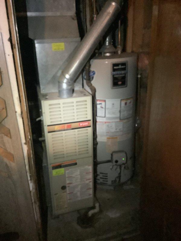Conducted estimate for replacement of 27-year-old HVAC system including air conditioning unit with failed compressor and furnace. Assessed existing equipment located in residential utility room and documented conditions for complete system replacement quote.
