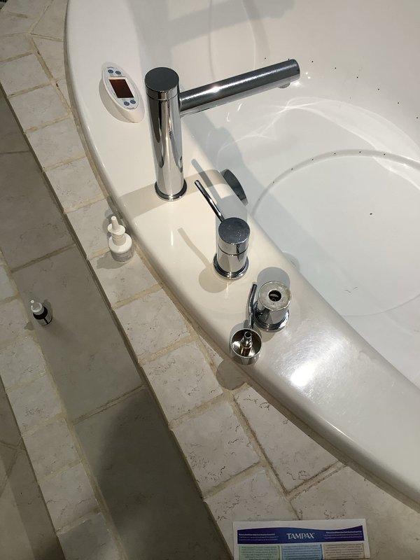 Responded to water leak complaint under bathroom sink. Upon inspection, identified leak at P-trap connection beneath basin. Tightened PVC coupling joints and verified proper seal at all connection points. Tested system by running water through drain line to confirm leak was resolved. All plumbing components functioning properly with no further water discharge detected.