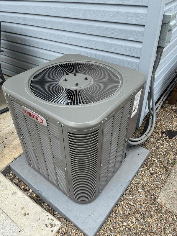 Completed comprehensive AC tune-up on three-year-old Lennox condenser unit. Cleaned heat exchanger coil assembly which had accumulated dust, dirt, and environmental debris on aluminum fins, restoring proper airflow and heat transfer efficiency. Inspected all components including fan assembly, electrical connections, and exterior housing; unit found to be in good operating condition with no deficiencies noted.