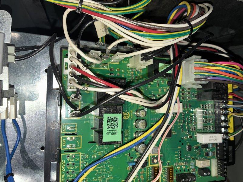 Completed warranty installation requiring replacement of control board assembly and wiring harness (part #94W02). Installed new printed circuit boards with integrated flame sense, outdoor sensor, and discharge air sensor connections. Replaced associated wire harnesses and verified all sensor inputs, capacitors, and control circuits functioning properly. System tested and operational upon completion.