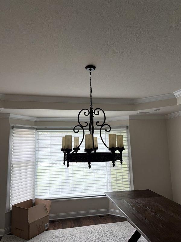 Installed six-light wrought iron chandelier with candle-style fixtures in dining area, ensuring proper mounting to ceiling junction box and secure electrical connections. Troubleshot non-functional string lights, identified faulty outlet as source of power issue, and replaced defective receptacle with new duplex outlet to restore functionality. Verified all fixtures operational and tested circuits for proper voltage and grounding.
