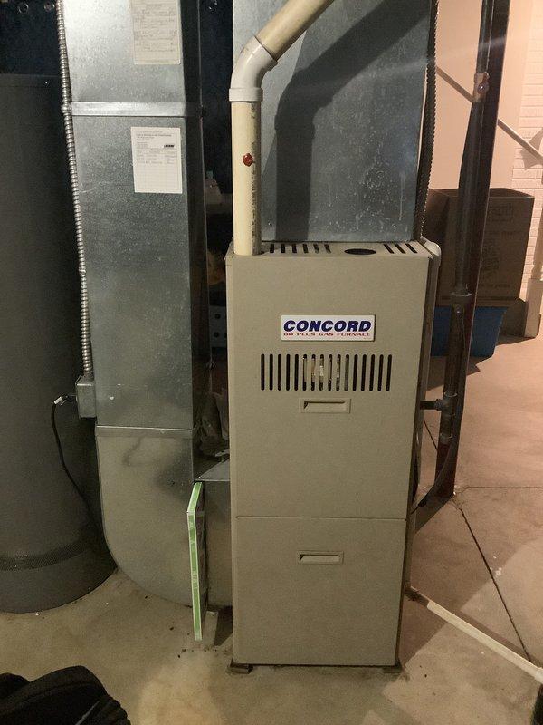 Conducted comprehensive HVAC system assessment for replacement estimate in residential basement mechanical room. Evaluated existing Concord brand furnace installation, associated electrical infrastructure, ductwork configuration, and utility connections including PVC venting and copper plumbing lines. Documented current equipment condition, spatial layout, and structural considerations for proposed system replacement through VA approval process.