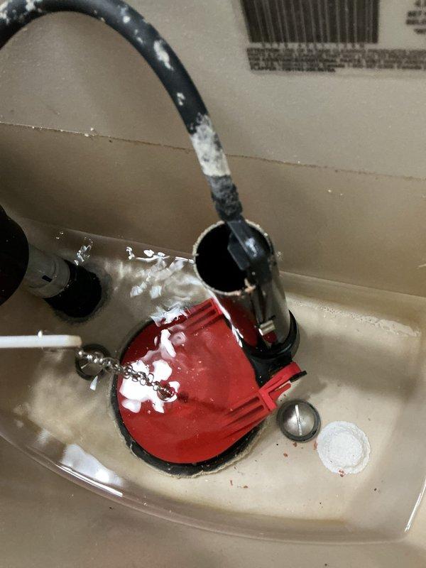 Responded to service call for non-functioning toilet with complete flush failure. Upon inspection, identified failed internal tank components including deteriorated flapper valve and malfunctioning fill valve assembly. Removed tank lid and assessed flush mechanism, noting compromised chain connection and improper water level management. Performed diagnostic evaluation of all tank hardware including overflow tube, flush valve seal, and float mechanism. Documented existing conditions showing mineral buildup and component wear. Completed system testing to verify operational issues and determined necessary repairs to restore proper flushing function.