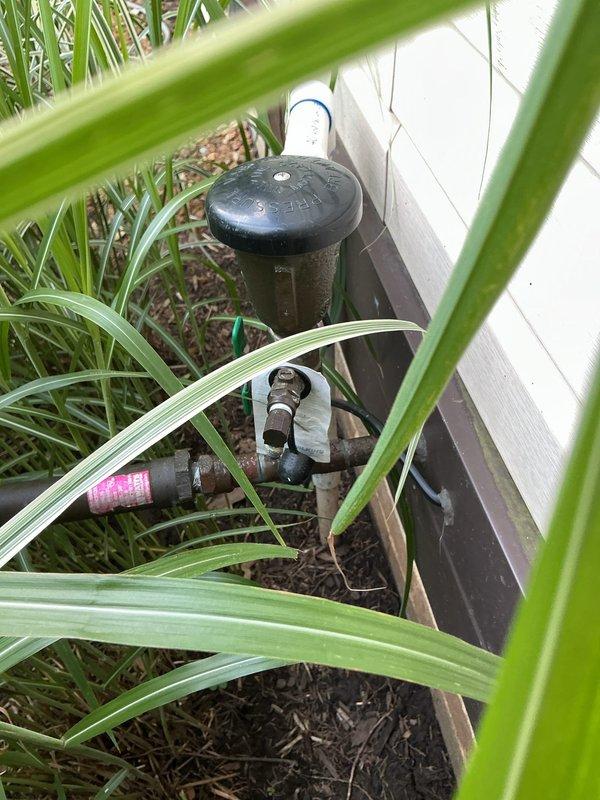 Completed annual backflow prevention device testing on irrigation system backflow assembly located at building exterior. Unit tested and certified in compliance with local water authority regulations, with all check valves and test cocks functioning properly within acceptable parameters.