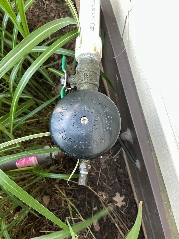 Completed annual backflow prevention device testing on irrigation system backflow assembly located at building exterior. Unit tested and certified in compliance with local water authority regulations, with all check valves and test cocks functioning properly within acceptable parameters.