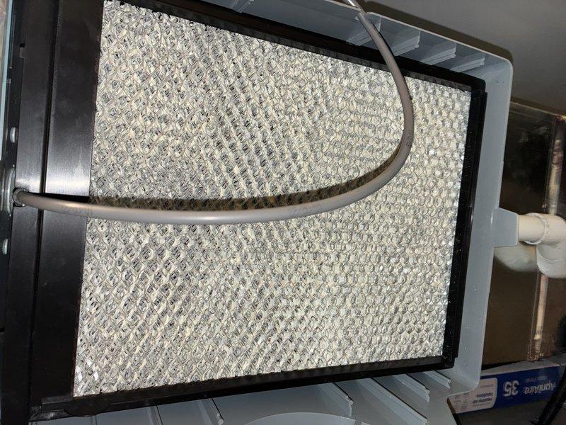 Completed MVP recurring cooling maintenance visit on 2-year-old system. Inspected and documented air filter condition and ductwork components, confirming proper installation and normal operating condition of flexible duct insulation and air handling unit components.