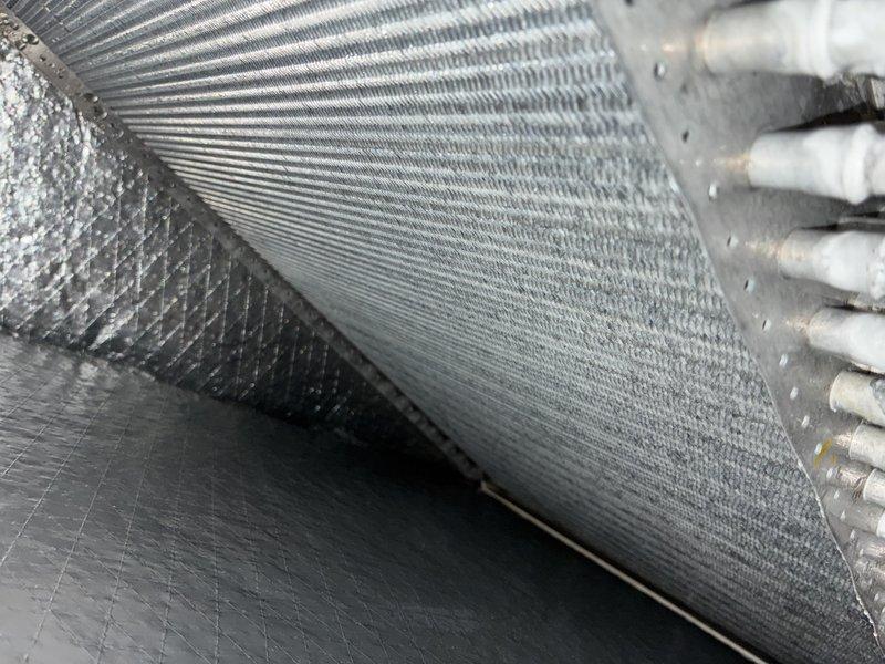 Completed MVP recurring cooling maintenance visit on 2-year-old system. Inspected and documented air filter condition and ductwork components, confirming proper installation and normal operating condition of flexible duct insulation and air handling unit components.