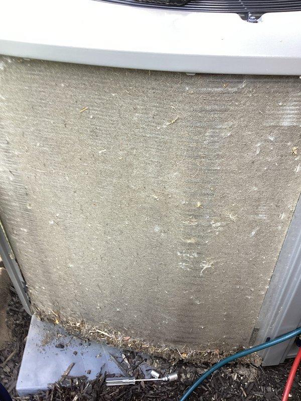 Completed scheduled MVP cooling maintenance visit on HVAC system. Upon inspection, discovered heavily soiled air filter with significant dust and debris accumulation requiring immediate replacement. Replaced failed 40A 250V AC time-delay fuse to restore proper system operation. Cleared organic debris and dirt buildup from unit base and surrounding area. System tested and confirmed operational following service completion.