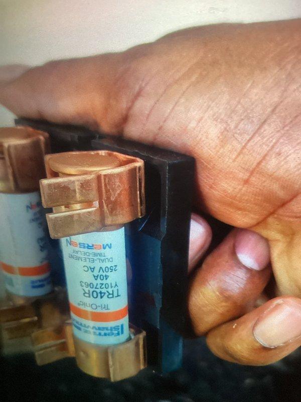 Completed scheduled MVP cooling maintenance visit on HVAC system. Upon inspection, discovered heavily soiled air filter with significant dust and debris accumulation requiring immediate replacement. Replaced failed 40A 250V AC time-delay fuse to restore proper system operation. Cleared organic debris and dirt buildup from unit base and surrounding area. System tested and confirmed operational following service completion.
