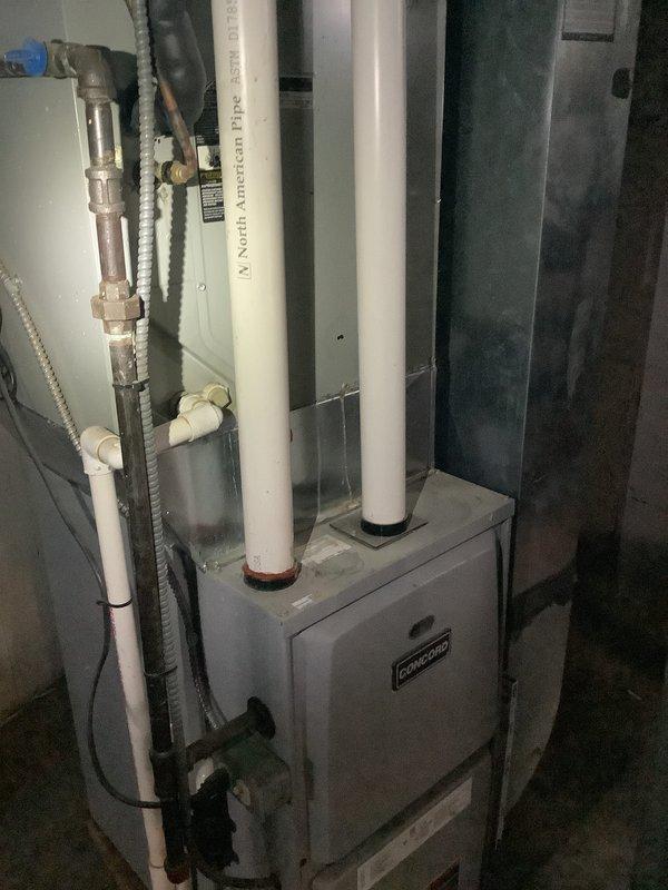 Completed on-site evaluation and provided estimate for complete HVAC system replacement including air conditioning unit and furnace in residential basement installation. Existing air conditioning system, approximately 25 years old, experiencing electrical issues with unit repeatedly tripping breaker circuit. Current furnace age undetermined but recommended for replacement as part of complete system upgrade. Assessment included existing Concord furnace with dual white PVC venting system, associated ductwork, and plumbing connections. Quoted high-efficiency replacement equipment to address electrical failures and improve system performance and energy efficiency.