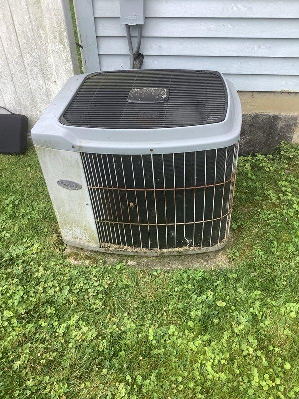 Responded to service call for central air conditioning system producing alarming sounds during operation. Upon arrival, inspected 40-year-old AC unit and associated ductwork. Examined outdoor condenser unit showing significant age-related wear and weathering on exterior surfaces and concrete pad. Investigated indoor ductwork and mechanical components in basement/utility area to identify source of noise. Assessed system operation and determined unit has reached end of serviceable life expectancy. Provided recommendations for system replacement due to advanced age and operational concerns affecting whole-house comfort.