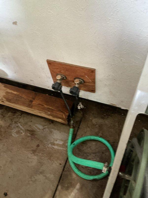 Responded to emergency service call for outdoor spigot that would not shut off. Located and identified the interior shut-off valves in the basement that control the exterior hose bibs, which were previously unknown to the homeowner. Successfully shut off water supply to the malfunctioning outdoor spigot using the brass shut-off valves mounted on the wooden plate near the main water supply line, stopping the continuous water flow and resolving the immediate emergency.