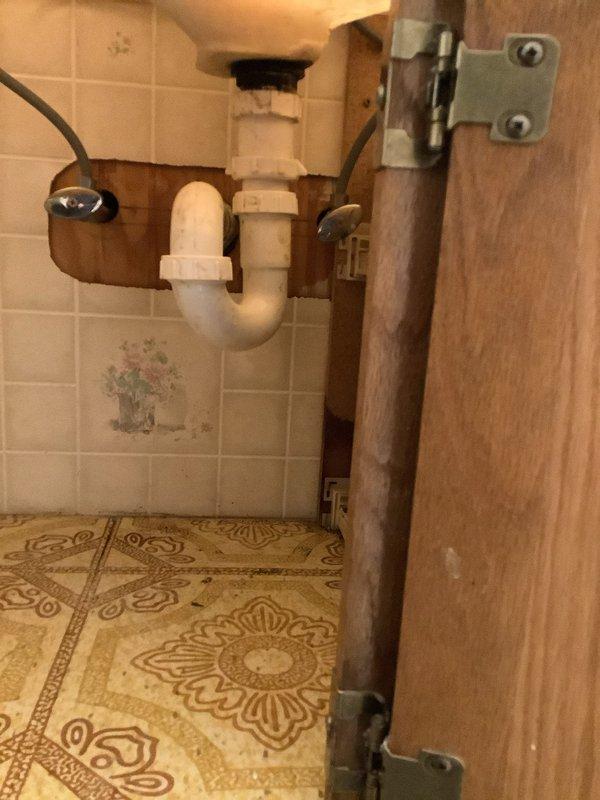 Responded to clogged bathroom sink drain call. Upon arrival, accessed plumbing beneath vanity cabinet and inspected P-trap assembly and drainage system. Removed obstruction from drain line, cleared blockage, and verified proper water flow through sink drain and P-trap. Tested drainage system to ensure complete restoration of function and confirmed no leaks at pipe connections before completing service.