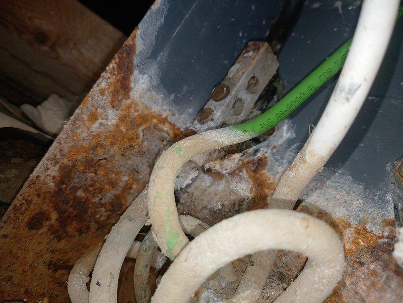 Responded to no power condition affecting half of residence following previous intermittent flickering issue. Upon investigation, discovered severely corroded and rusted electrical junction box in basement utility area with significant deterioration compromising electrical connections. The extensive rust and oxidation on the metal enclosure indicated long-term moisture exposure, which was causing intermittent contact issues that progressed to complete power loss. Documented conditions with photos showing the failed electrical components and surrounding infrastructure deterioration requiring immediate attention for safe restoration of power to affected circuits.