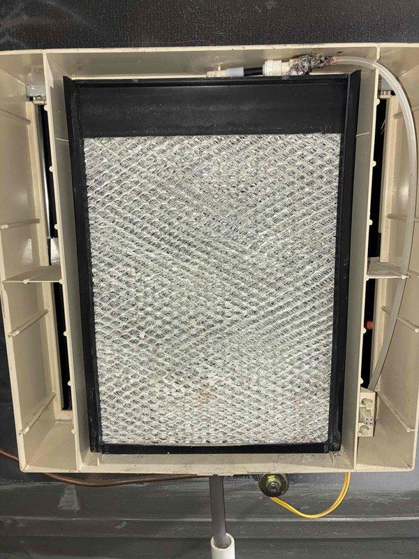 Completed comprehensive AC tune-up on Lennox outdoor condensing unit. Inspected and serviced indoor air handler, verified air filter condition showing normal dust accumulation within acceptable parameters, and confirmed proper system operation of all components.