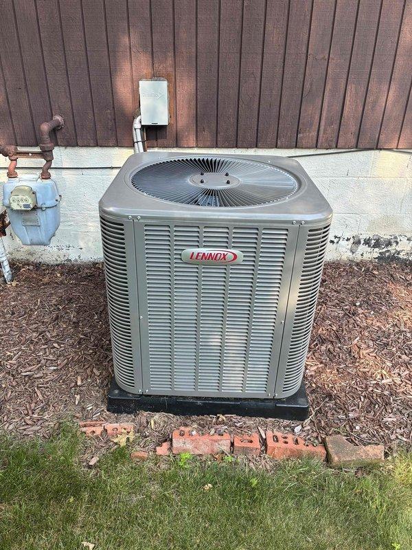 Completed comprehensive AC tune-up on Lennox outdoor condensing unit. Inspected and serviced indoor air handler, verified air filter condition showing normal dust accumulation within acceptable parameters, and confirmed proper system operation of all components.