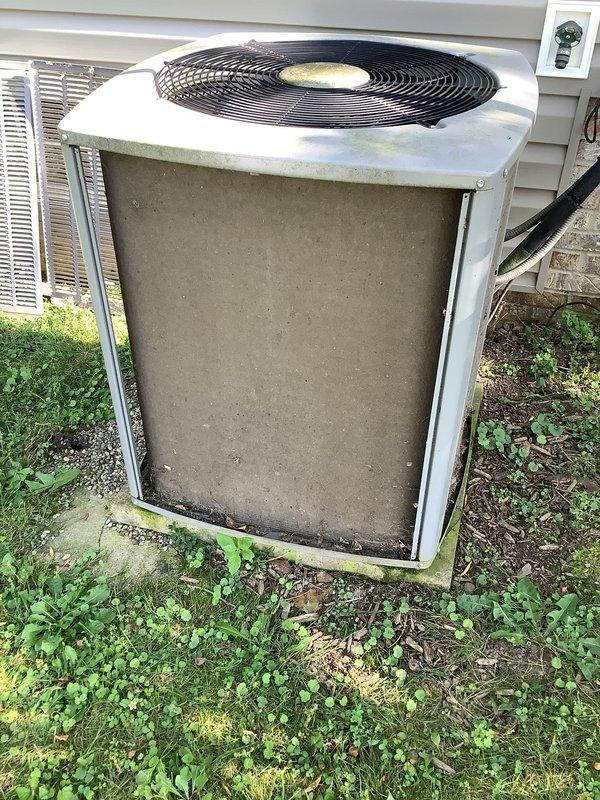 Responded to no cooling complaint on approximately 10-year-old residential air conditioning system. Upon arrival, found outdoor condenser unit heavily soiled with accumulated dirt and debris on exterior panels and coils, with vegetation growth around base potentially restricting airflow. Inspected indoor furnace and air handler equipment in basement, noting standard forced-air configuration with PVC condensate drainage system. Diagnosed cooling issue, performed necessary repairs to restore system operation, and recommended routine maintenance including coil cleaning and vegetation clearance to ensure optimal performance and efficiency.
