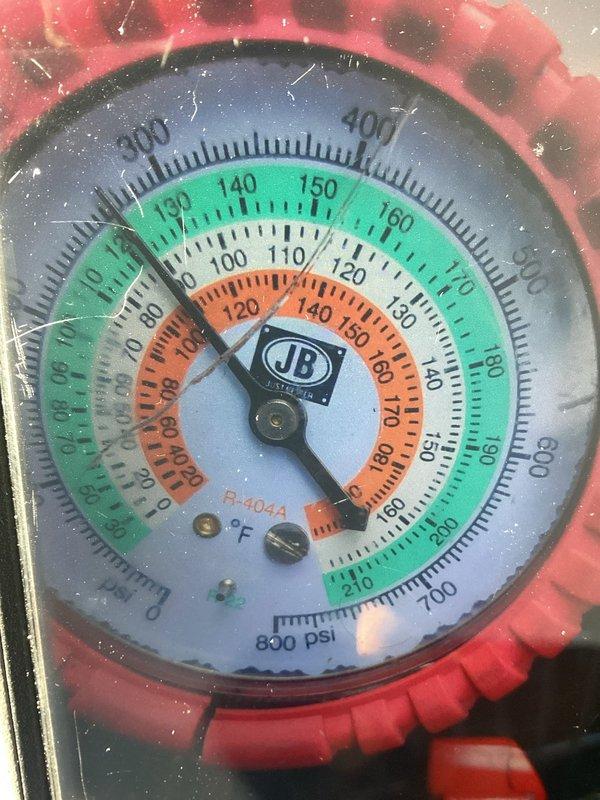 Responded to AC unit with frozen evaporator coil condition. Upon arrival, system was heavily frosted and unable to be serviced immediately. Advised homeowner to power off unit and allow complete defrost before diagnostic work could proceed. Returned for follow-up appointment to assess system pressures using refrigerant gauges for R-404A, confirming refrigerant levels and identifying root cause of freezing condition.