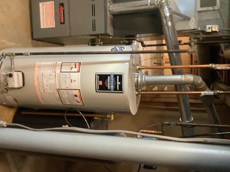 Responded to service call for 3-year-old Bradford water heater experiencing pilot flame issues. Diagnosed faulty thermopile and malfunctioning control valve that would blink but fail to click or maintain pilot signal. Replaced both the thermopile and gas control valve to restore proper operation. Verified pilot light ignition, flame sensing, and burner operation upon completion.
