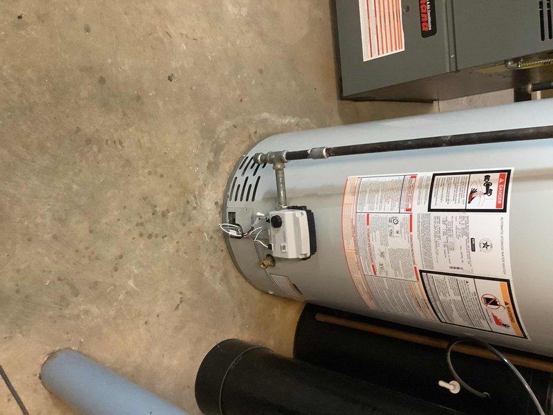 Responded to service call for 3-year-old Bradford water heater experiencing pilot flame issues. Diagnosed faulty thermopile and malfunctioning control valve that would blink but fail to click or maintain pilot signal. Replaced both the thermopile and gas control valve to restore proper operation. Verified pilot light ignition, flame sensing, and burner operation upon completion.