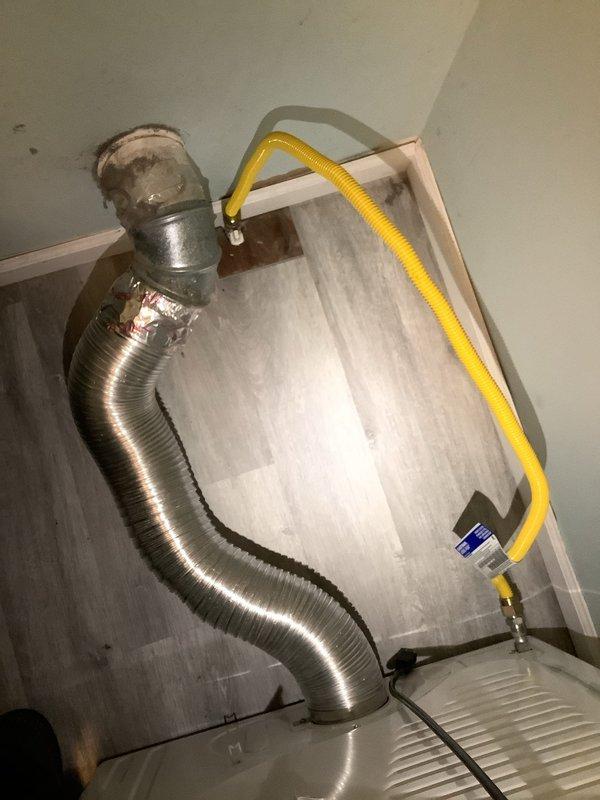 Installed gas line fitting and valve assembly for dryer connection. Ran flexible gas line from wall-mounted shut-off valve with proper fittings and secured all connections to code. System tested and verified operational for safe appliance use.